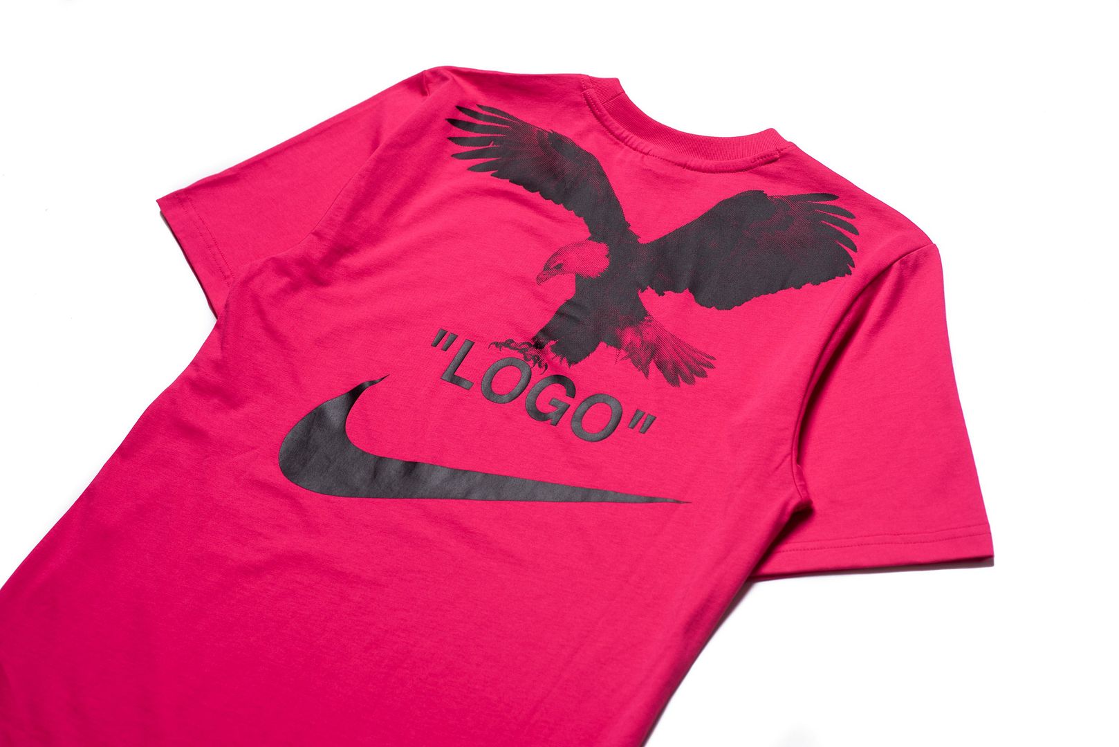 white nike shirt with pink logo